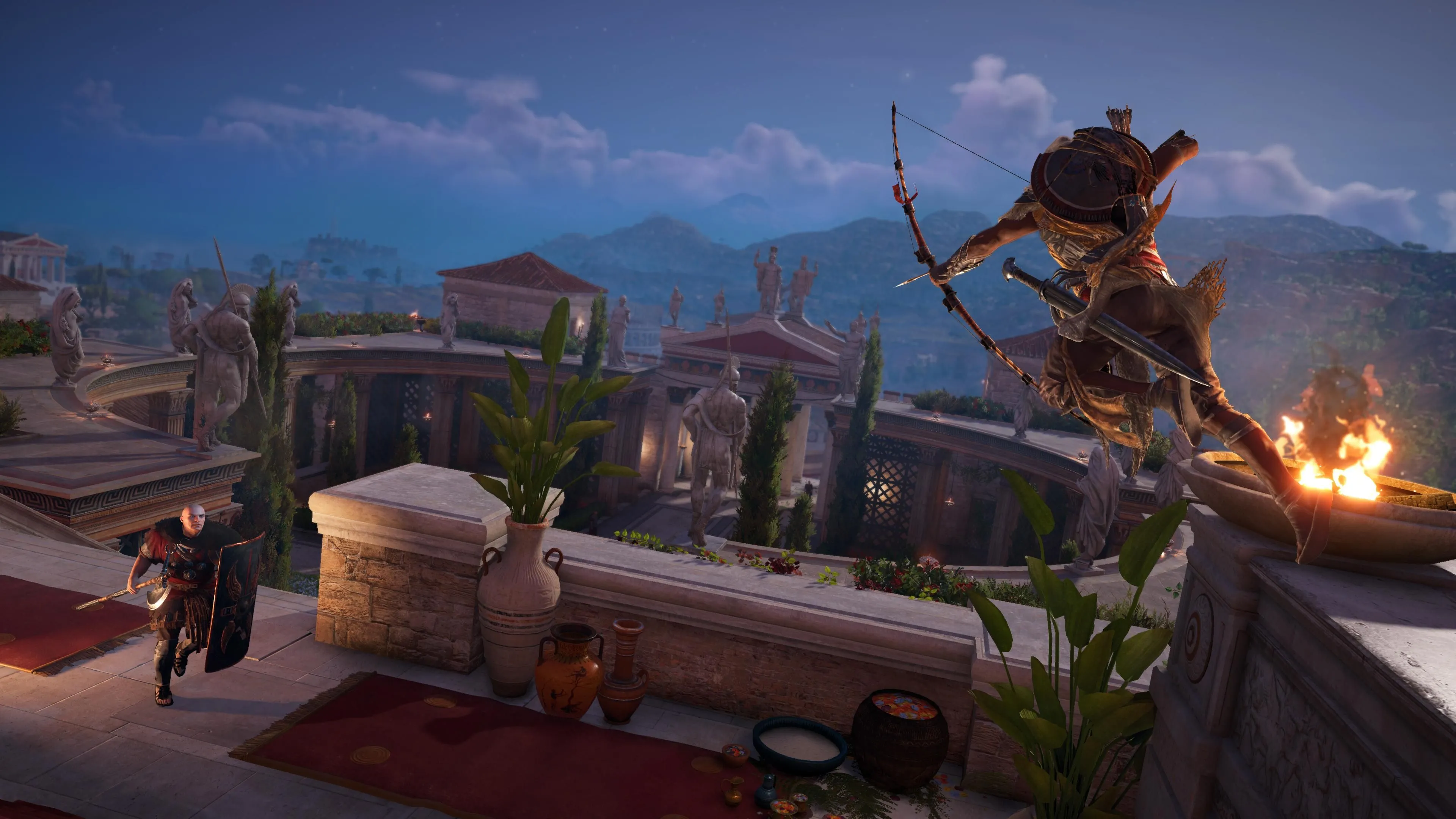 Bayek nhảy từ gờ tường và nhắm cung vào một người lính có khiên trong Assassin's Creed Origins