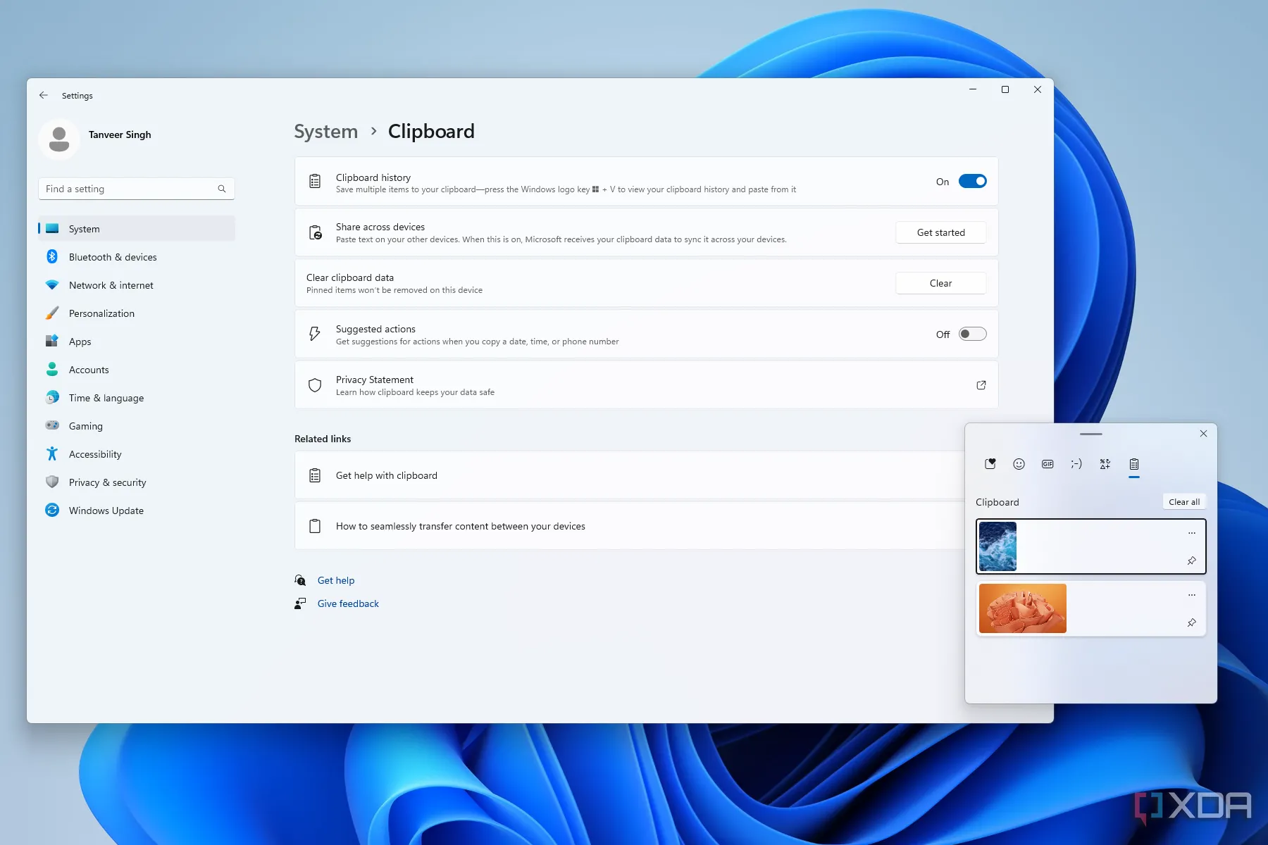 Màn hình desktop Windows 11 với cửa sổ cài đặt lịch sử clipboard hiển thị tùy chọn đồng bộ hóa.