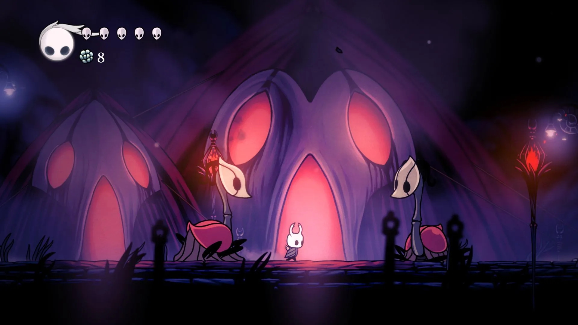 Hollow Knight, một tựa game platformer Metroidvania kinh điển, với nhân vật chính đứng giữa hai kẻ thù