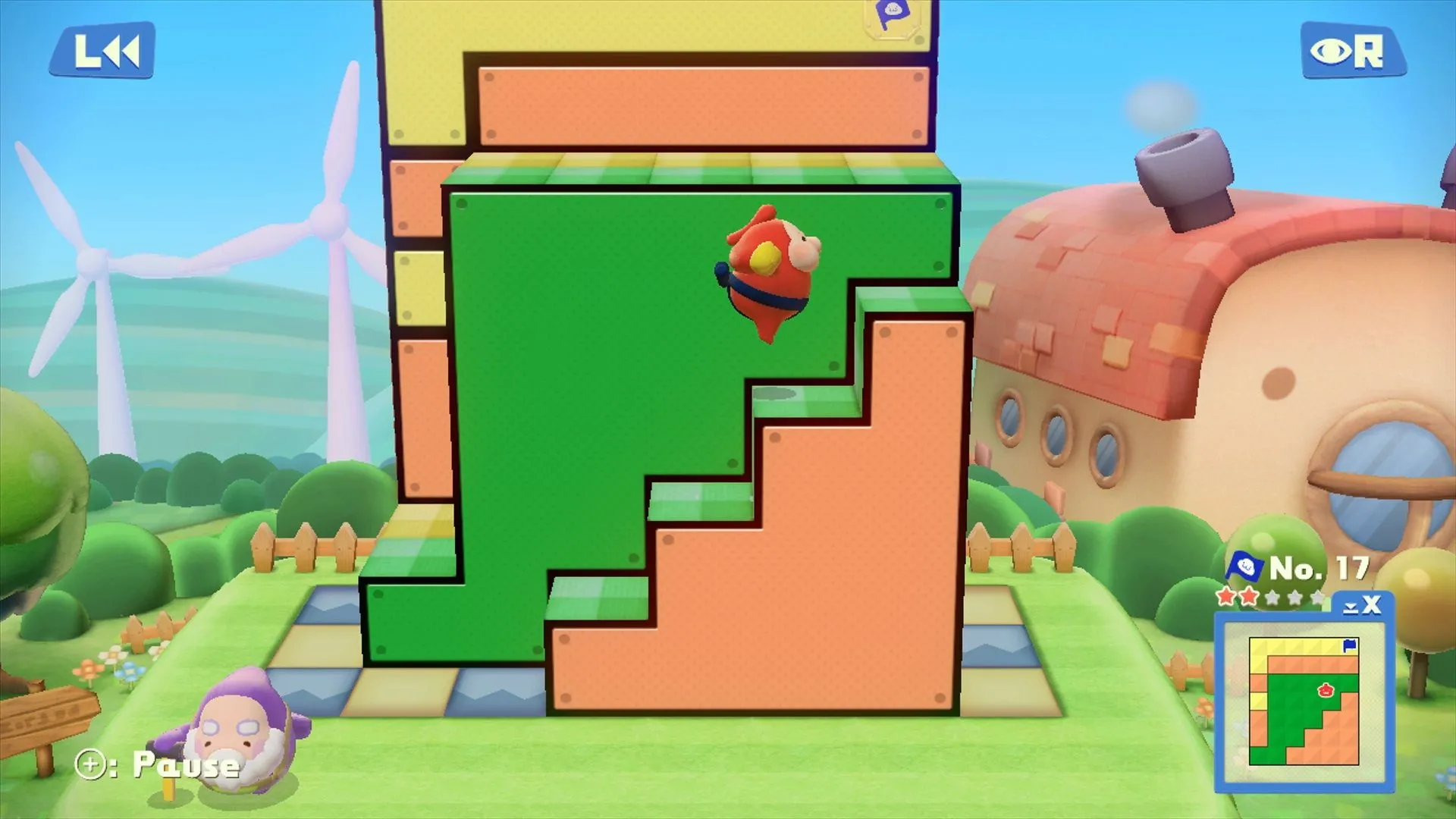 Màn hình chơi game Pushmo World trên Wii U, hiển thị một câu đố khối hộp với nhân vật Mallo đang cố gắng di chuyển các khối để leo lên đỉnh cờ, minh họa lối chơi giải đố độc đáo.