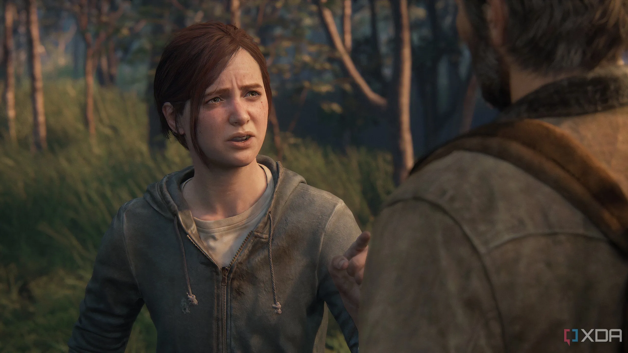 Một ảnh chụp màn hình từ game The Last of Us Part II Remastered trên PC, mô tả một cuộc trò chuyện đầy cảm xúc giữa Ellie và Joel.