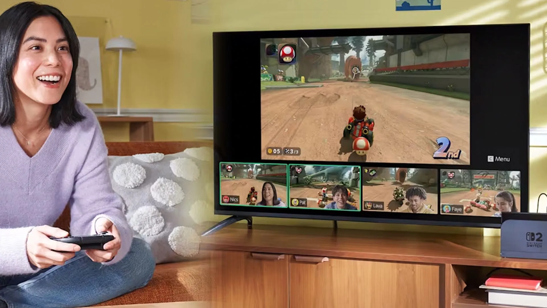 Một người đang chơi Mario Kart World trên Nintendo Switch 2, với các phụ kiện được bố trí gần đó.