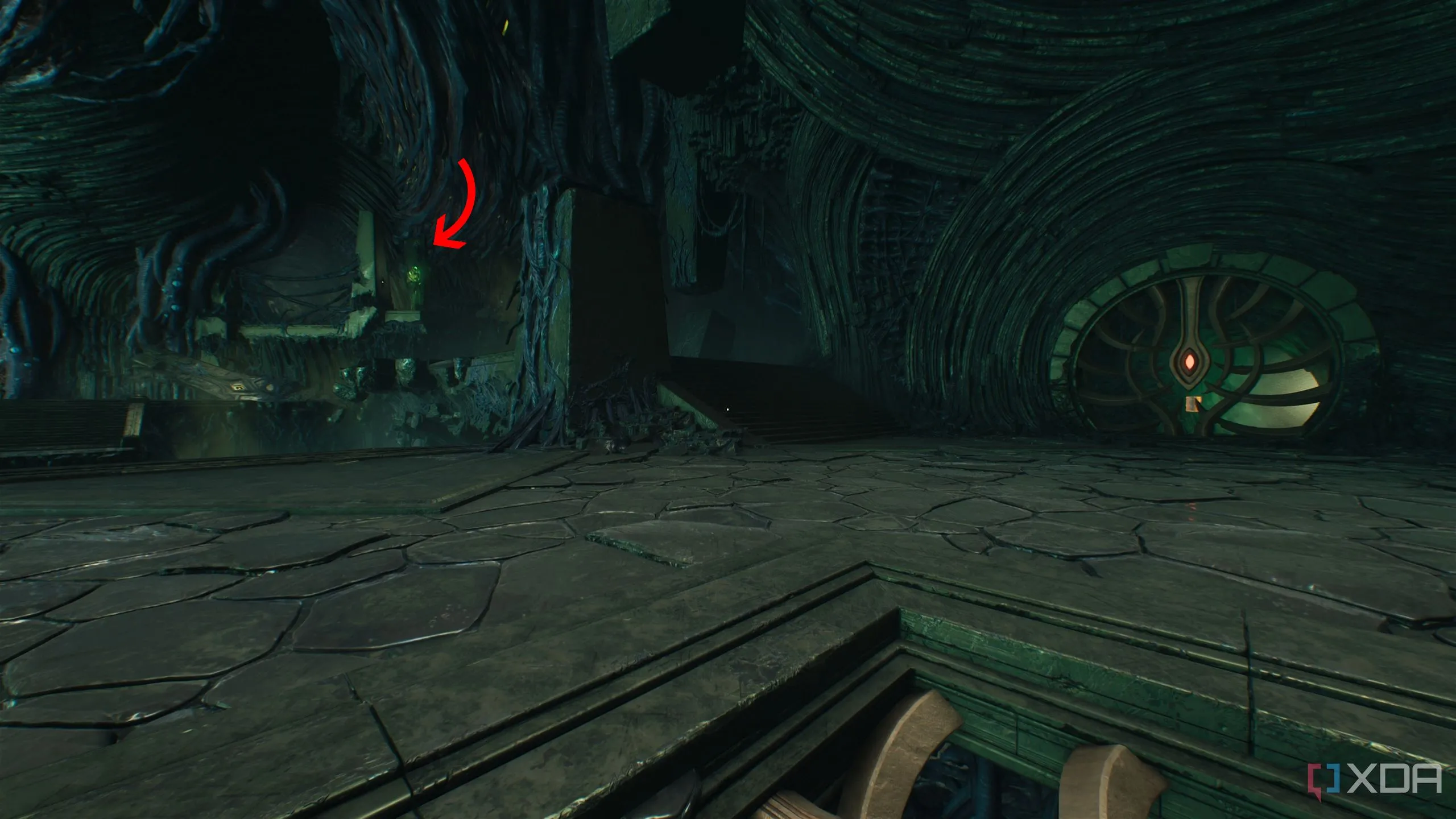 Mũi tên chỉ một nút thịt xanh ở xa trong Chương 15 Doom The Dark Ages, cần sử dụng Shield Recall Jump.